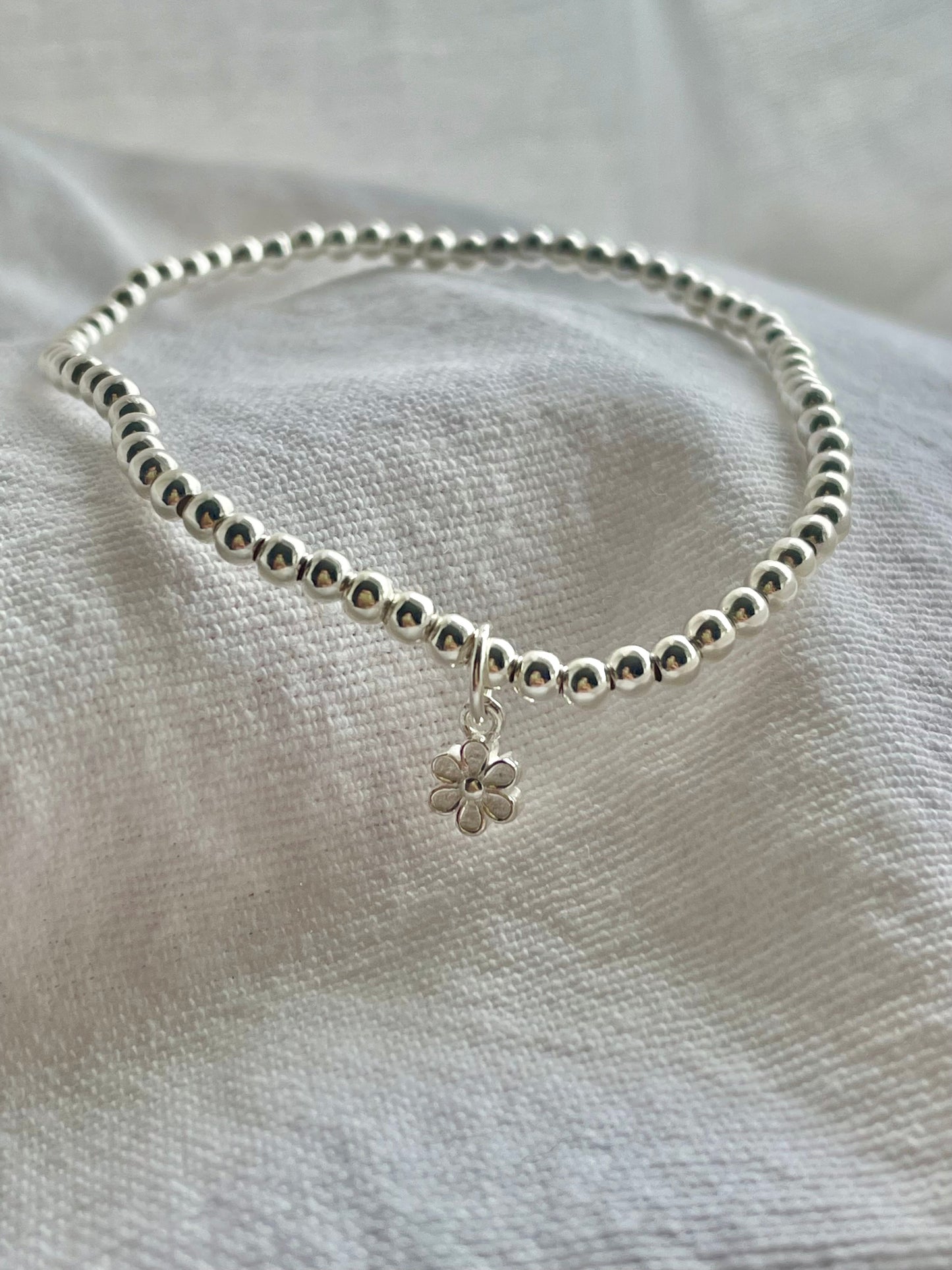 Sterling Silver Bracelet with small flower charm