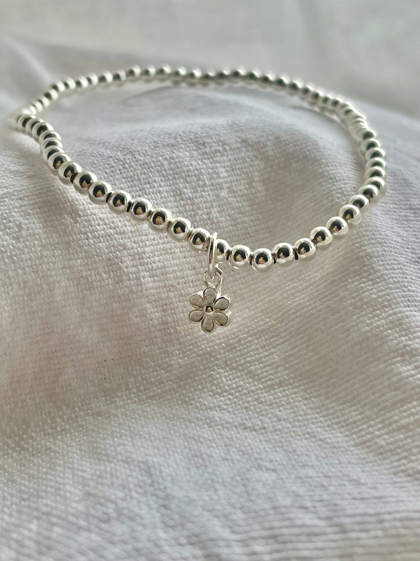 Sterling Silver Bracelet with small flower charm