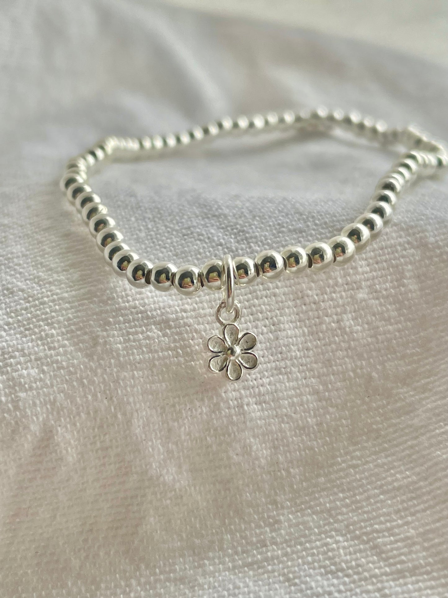 Sterling Silver Bracelet with small flower charm