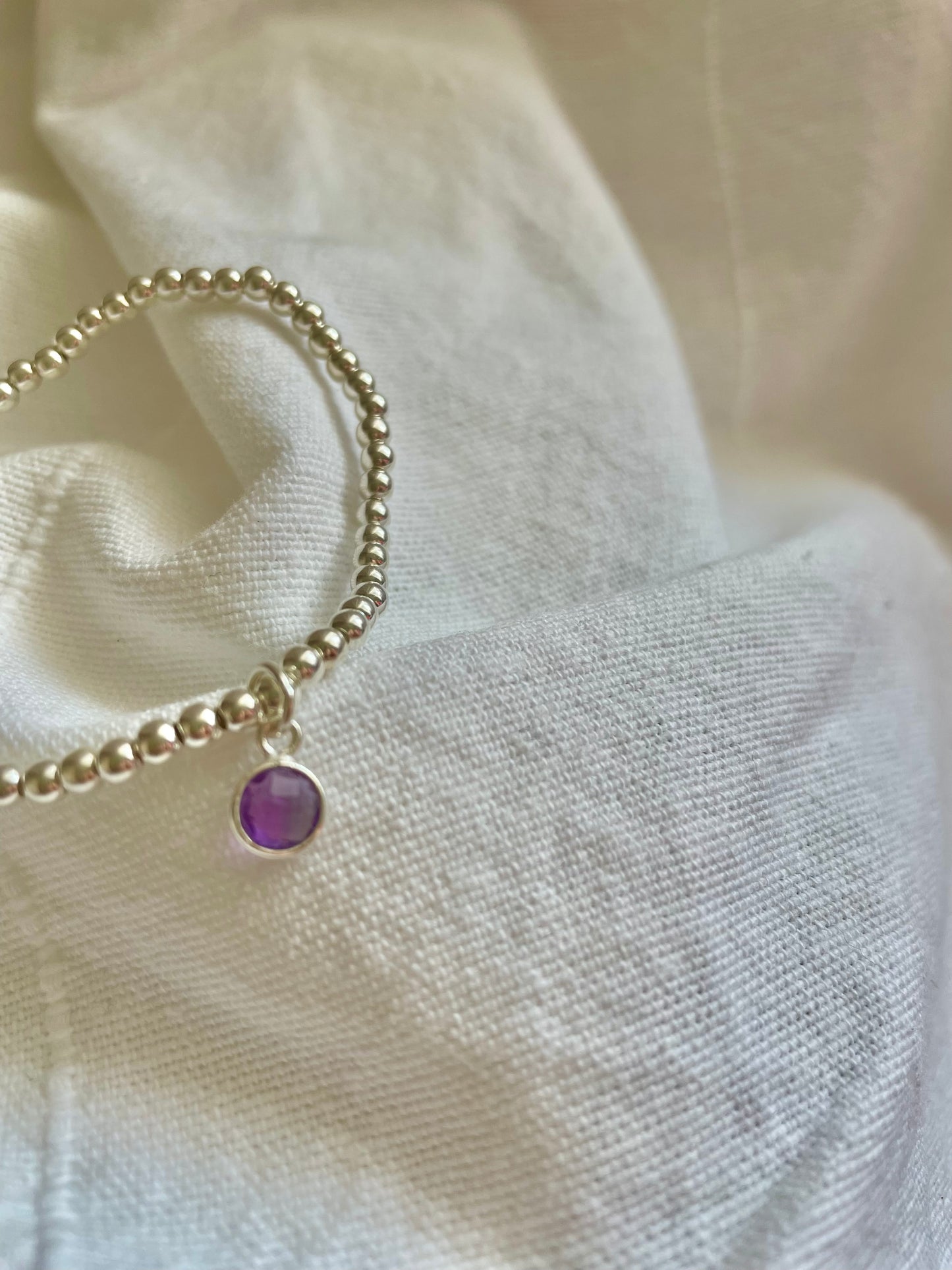 Sterling Silver Bracelet with Amethyst Circle Charm