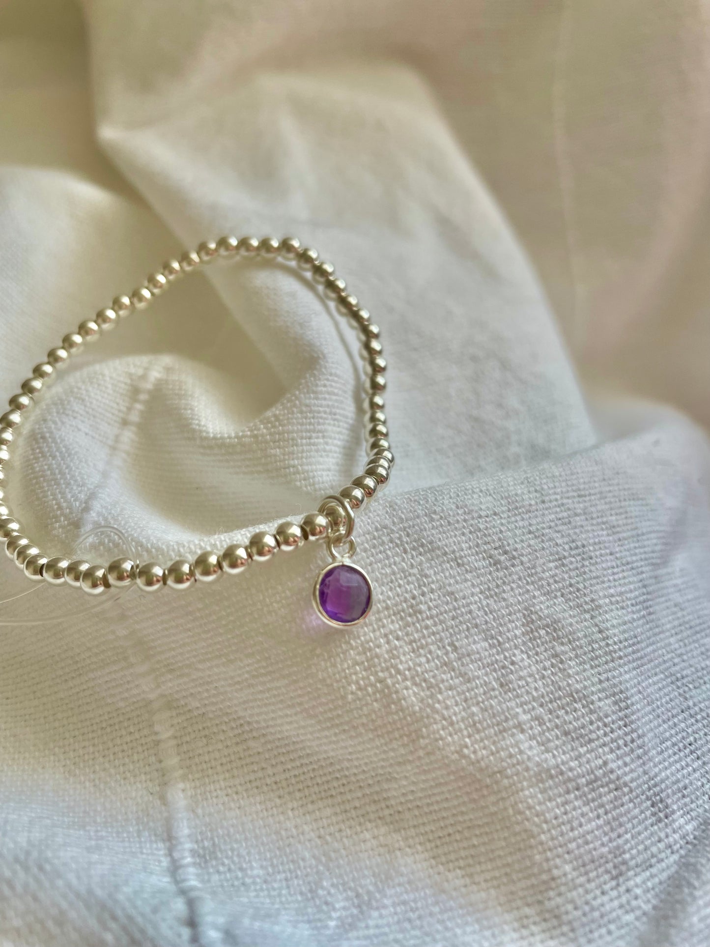 Sterling Silver Bracelet with Amethyst Circle Charm