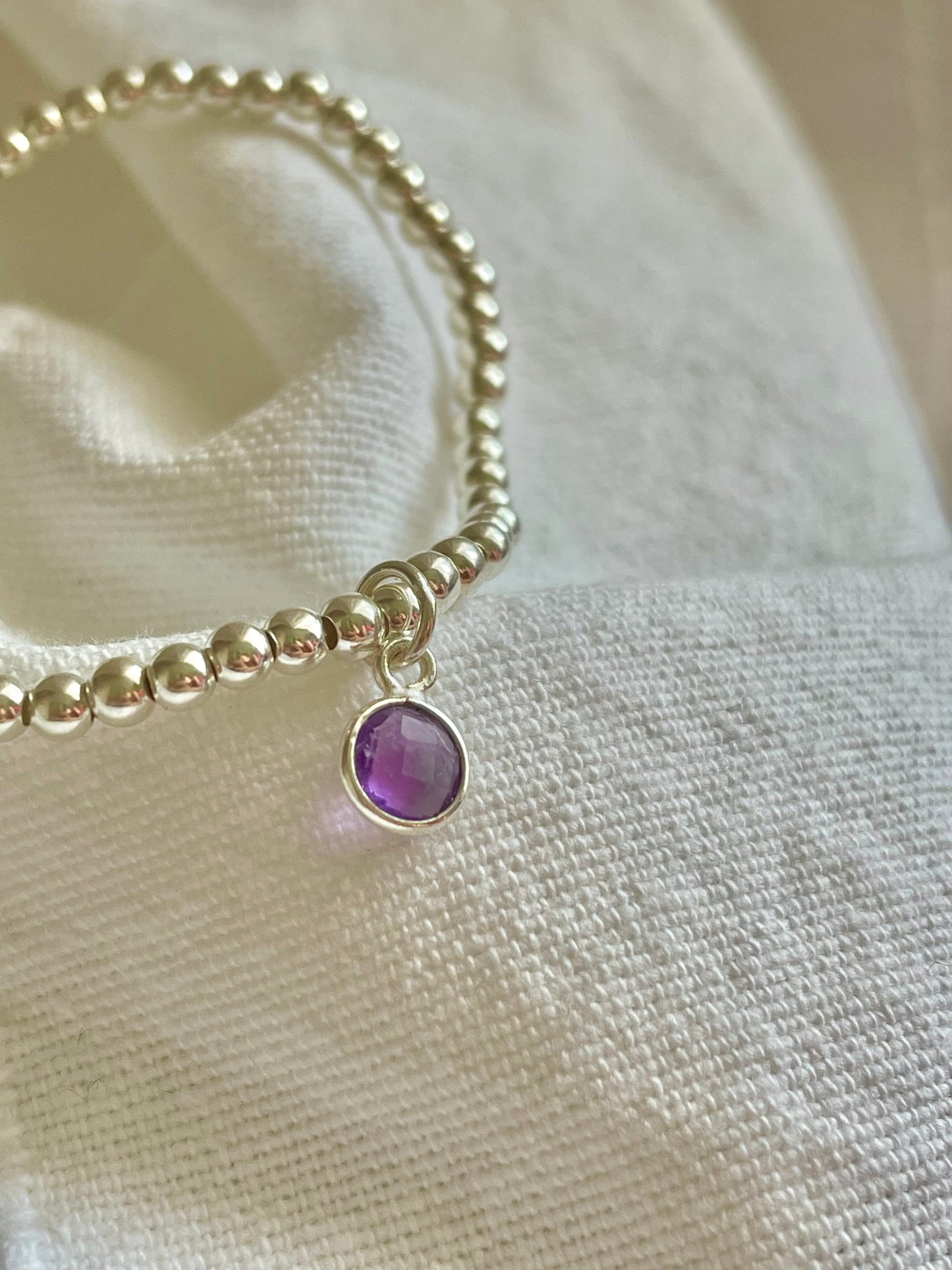 Sterling Silver Bracelet with Amethyst Circle Charm